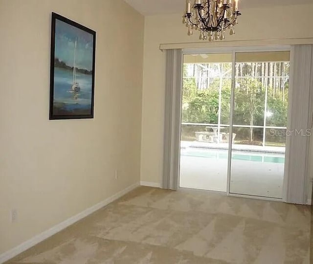 37 Ethan Allen Dr, Palm Coast, FL 32164 - unfurnished dining area featuring a chandelier and baseboards