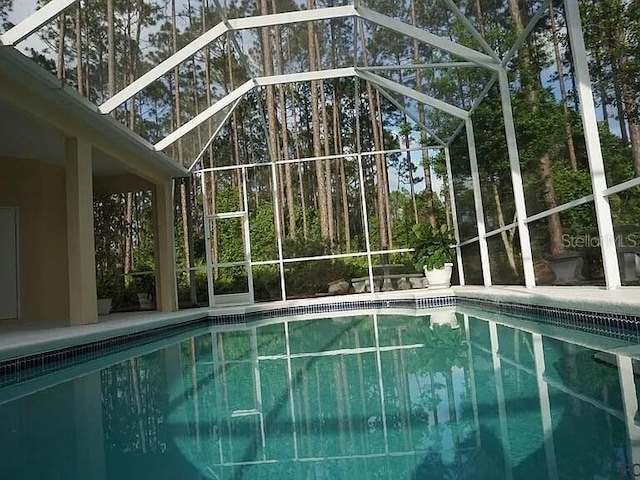 37 Ethan Allen Dr, Palm Coast, FL 32164 - outdoor pool featuring a lanai and a patio