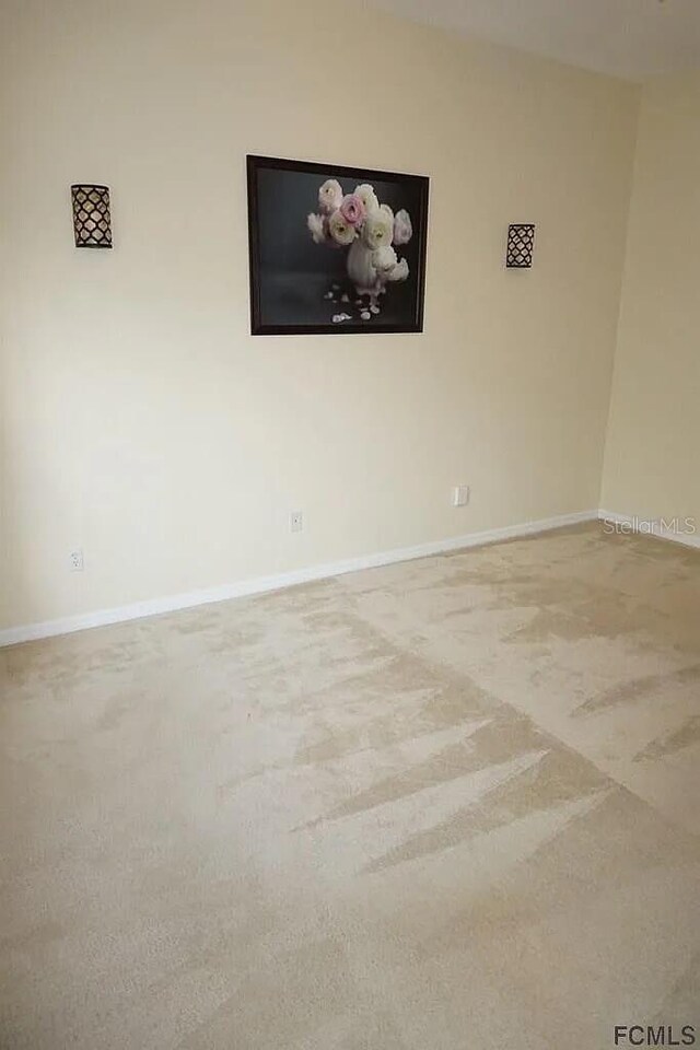 37 Ethan Allen Dr, Palm Coast, FL 32164 - unfurnished room featuring carpet floors and baseboards