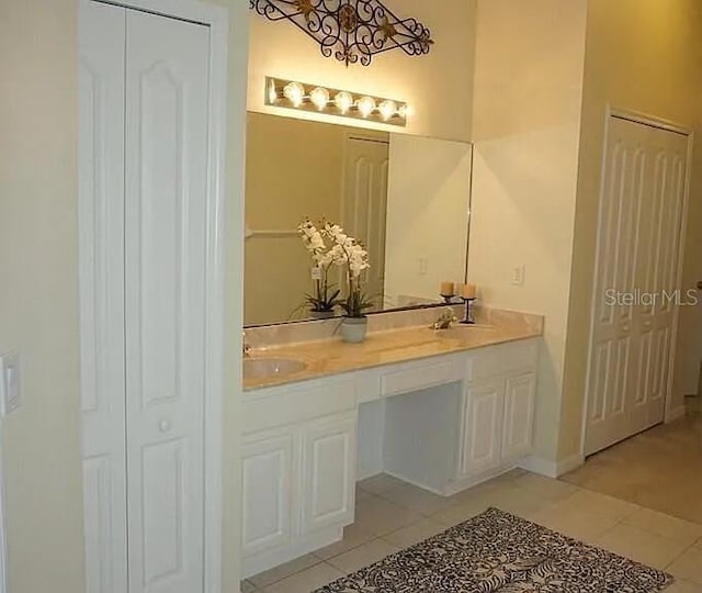 37 Ethan Allen Dr, Palm Coast, FL 32164 - full bath featuring a closet, tile patterned flooring, and double vanity