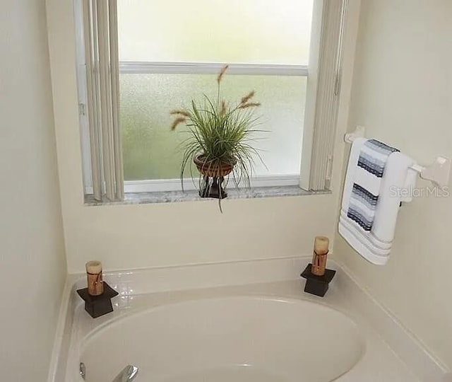 37 Ethan Allen Dr, Palm Coast, FL 32164 - bathroom with a garden tub