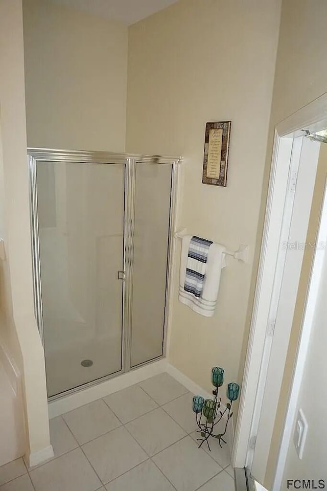 37 Ethan Allen Dr, Palm Coast, FL 32164 - full bath with tile patterned floors, a shower stall, and heating unit