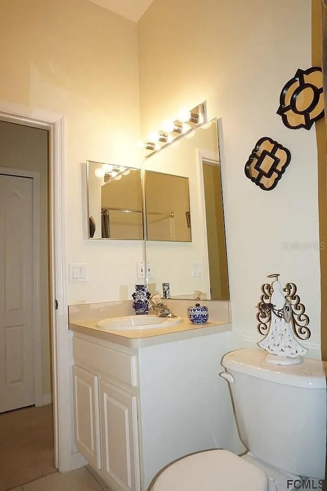 37 Ethan Allen Dr, Palm Coast, FL 32164 - bathroom featuring toilet and vanity