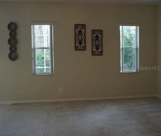 37 Ethan Allen Dr, Palm Coast, FL 32164 - carpeted spare room with healthy amount of natural light