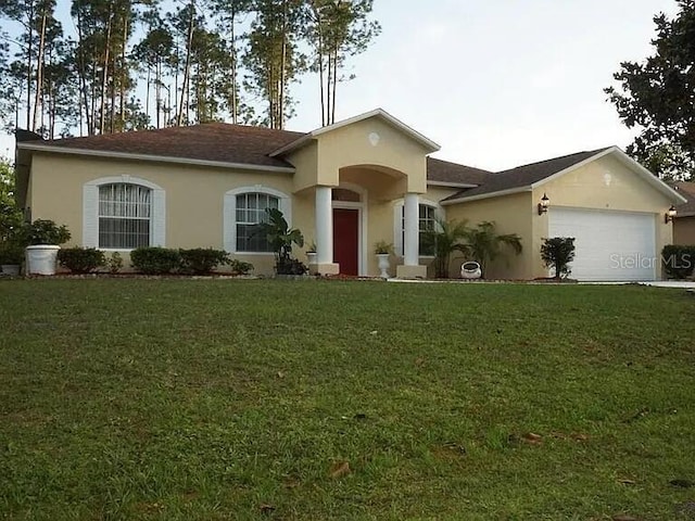 37 Ethan Allen Dr, Palm Coast, FL 32164 - ranch-style house featuring an attached garage, stucco siding, and a front lawn