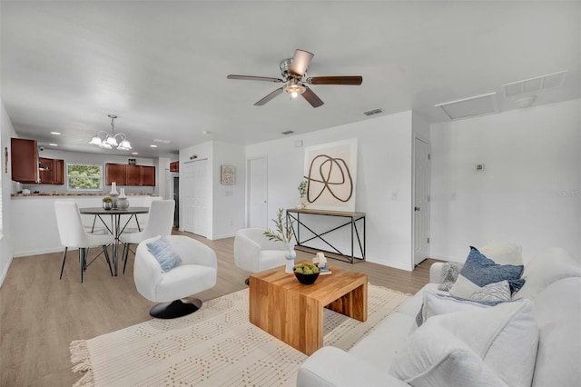 9 Summerset Ter, Casselberry, FL 32707 - living area with light wood-type flooring, ceiling fan, and a chandelier