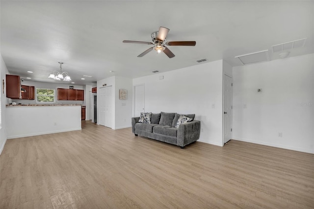 9 Summerset Ter, Casselberry, FL 32707 - living area featuring light wood finished floors, a ceiling fan, and a chandelier