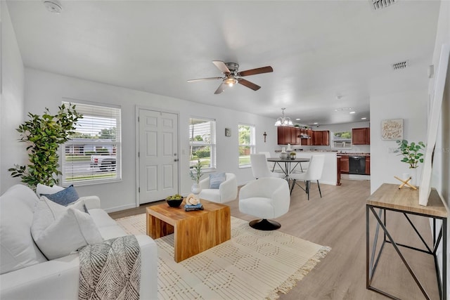 9 Summerset Ter, Casselberry, FL 32707 - living room with a ceiling fan, light wood finished floors, and a chandelier