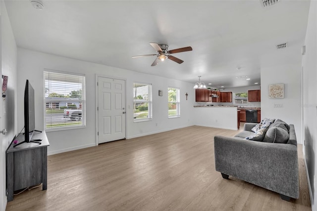 9 Summerset Ter, Casselberry, FL 32707 - living area featuring ceiling fan, light wood-style flooring, and a chandelier
