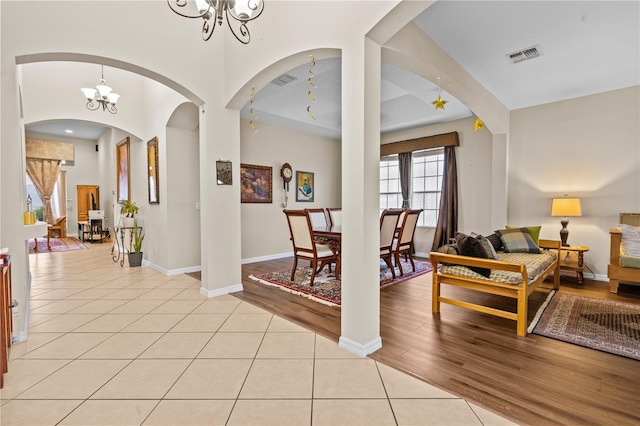 8804 Warwick Shore Xing Unit X, Orlando, FL 32829 - foyer featuring a chandelier, light tile patterned floors, and arched walkways
