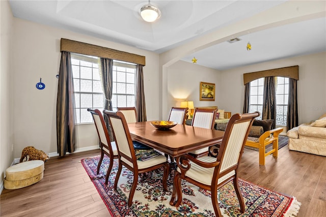 8804 Warwick Shore Xing Unit X, Orlando, FL 32829 - dining room featuring light wood finished floors and arched walkways