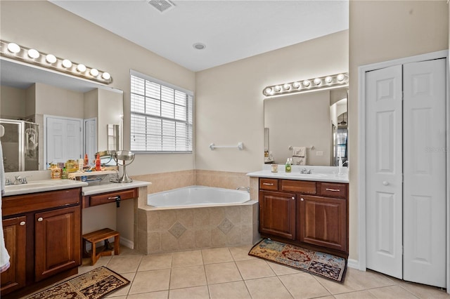 8804 Warwick Shore Xing Unit X, Orlando, FL 32829 - full bath featuring a closet, tile patterned floors, two vanities, and a stall shower