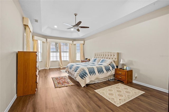 8804 Warwick Shore Xing Unit X, Orlando, FL 32829 - bedroom featuring wood finished floors, a raised ceiling, recessed lighting, and a ceiling fan