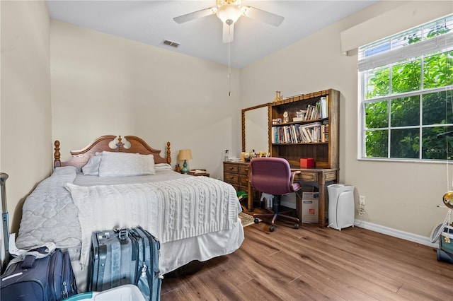 8804 Warwick Shore Xing Unit X, Orlando, FL 32829 - bedroom featuring wood finished floors and a ceiling fan
