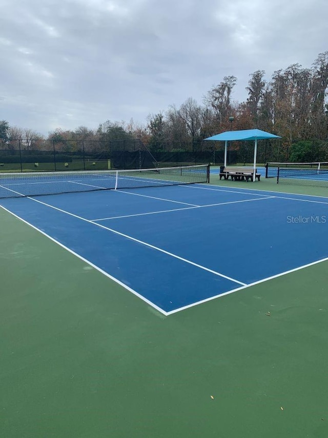 8804 Warwick Shore Xing Unit X, Orlando, FL 32829 - view of tennis court featuring community basketball court