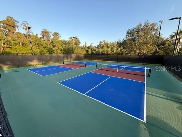 8804 Warwick Shore Xing Unit X, Orlando, FL 32829 - view of tennis court with community basketball court