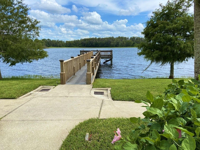 8804 Warwick Shore Xing Unit X, Orlando, FL 32829 - dock area with a water view, a lawn, and a boat ramp