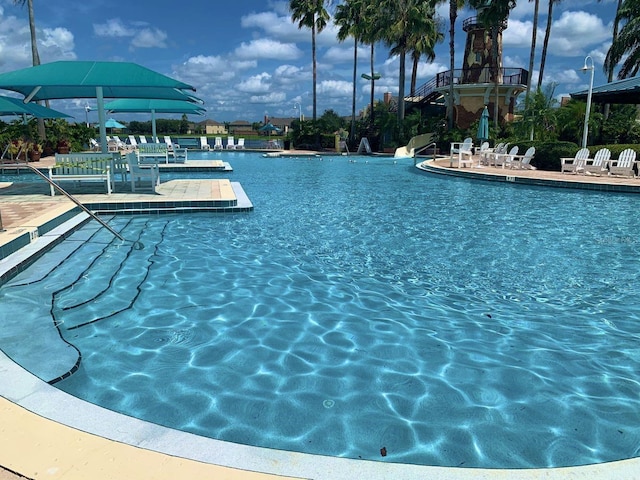 8804 Warwick Shore Xing Unit X, Orlando, FL 32829 - community pool featuring a patio area