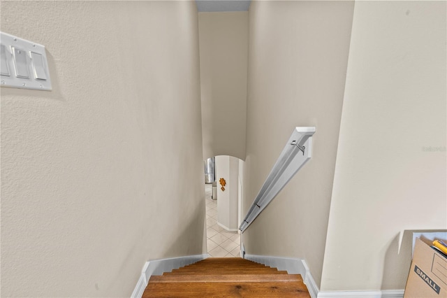 8804 Warwick Shore Xing Unit X, Orlando, FL 32829 - stairway with arched walkways and tile patterned floors