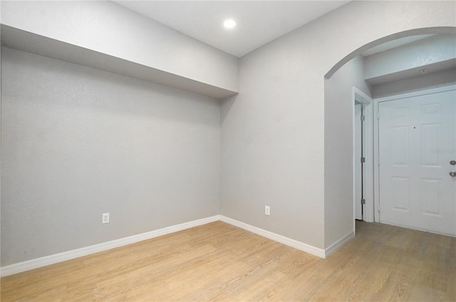 826 Camargo Way Unit 201, Altamonte Springs, FL 32714 - empty room featuring arched walkways, light wood-style floors, and recessed lighting