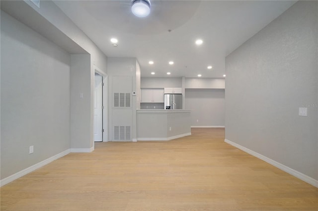 826 Camargo Way Unit 201, Altamonte Springs, FL 32714 - unfurnished living room with recessed lighting, light wood-type flooring, and a ceiling fan