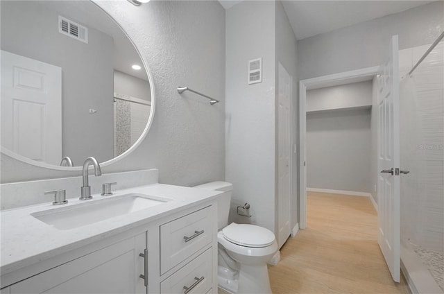 826 Camargo Way Unit 201, Altamonte Springs, FL 32714 - full bathroom featuring a shower with curtain, wood finished floors, and vanity