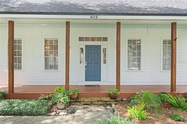 403 Courtlea Creek Dr, Winter Garden, FL 34787 - entrance to property with a shingled roof and covered porch