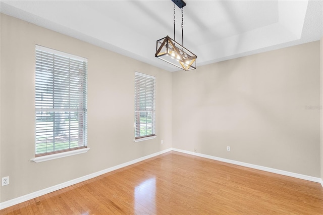 403 Courtlea Creek Dr, Winter Garden, FL 34787 - empty room with light wood-style floors and a chandelier