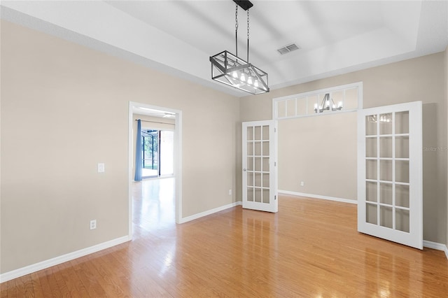 403 Courtlea Creek Dr, Winter Garden, FL 34787 - spare room with french doors, a chandelier, and light wood-type flooring