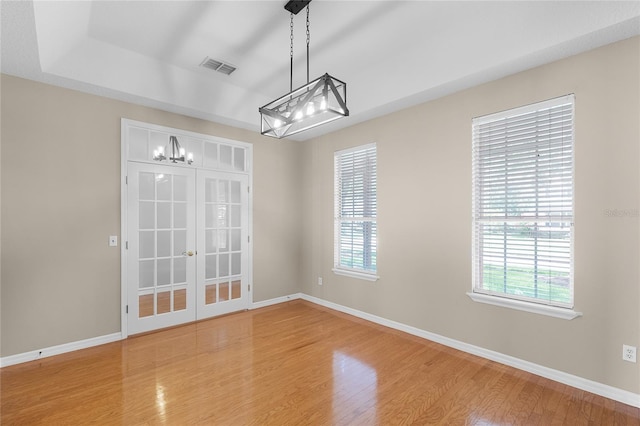 403 Courtlea Creek Dr, Winter Garden, FL 34787 - empty room featuring light wood-type flooring, french doors, and a chandelier