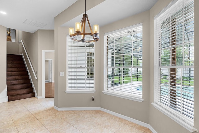 403 Courtlea Creek Dr, Winter Garden, FL 34787 - unfurnished dining area featuring a chandelier, tile patterned floors, and stairs
