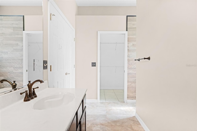 403 Courtlea Creek Dr, Winter Garden, FL 34787 - full bathroom featuring vanity, a walk in closet, and tile patterned floors