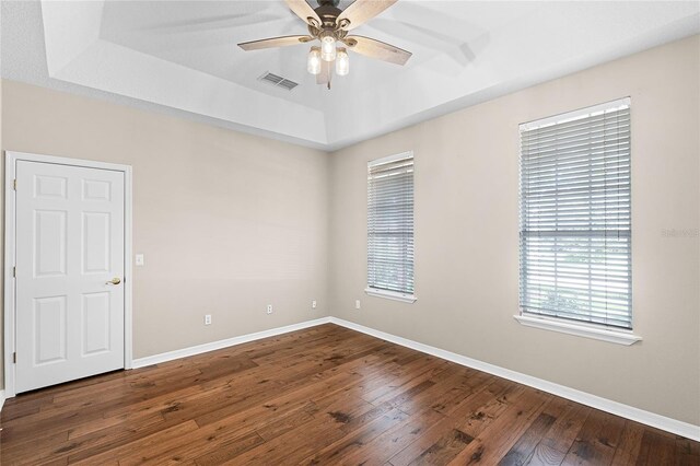403 Courtlea Creek Dr, Winter Garden, FL 34787 - empty room featuring a raised ceiling, ceiling fan, and hardwood / wood-style flooring