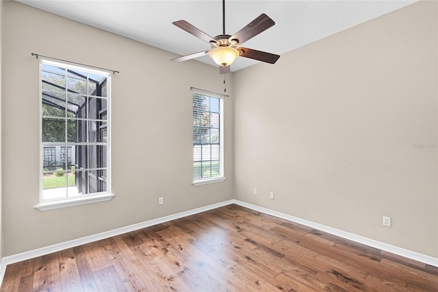 403 Courtlea Creek Dr, Winter Garden, FL 34787 - spare room featuring plenty of natural light, hardwood / wood-style floors, and ceiling fan