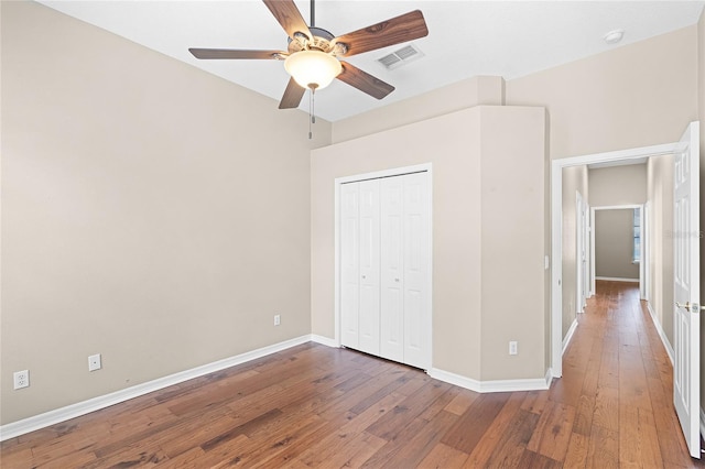 403 Courtlea Creek Dr, Winter Garden, FL 34787 - unfurnished bedroom featuring hardwood / wood-style floors, a closet, and ceiling fan