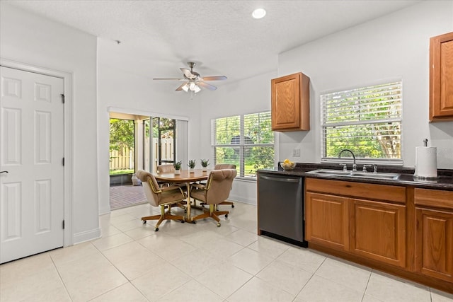 7348 Regina Way, Orlando, FL 32819 - kitchen featuring dishwasher, dark countertops, brown cabinets, and recessed lighting
