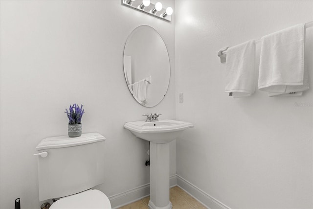 7348 Regina Way, Orlando, FL 32819 - half bath featuring toilet and tile patterned floors