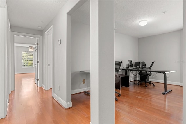 7348 Regina Way, Orlando, FL 32819 - home office featuring light wood finished floors and a textured ceiling