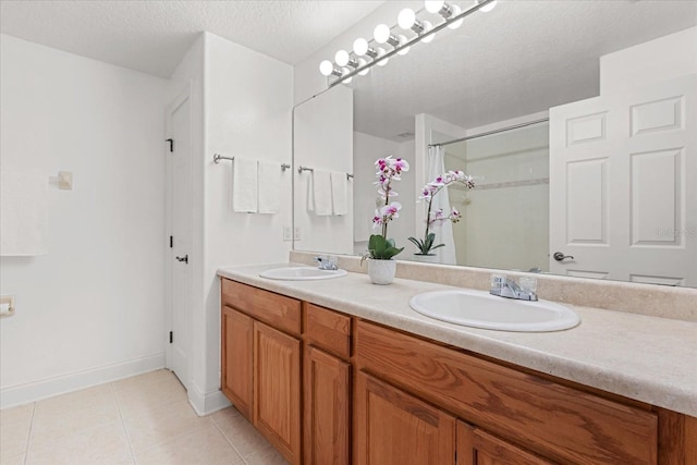 7348 Regina Way, Orlando, FL 32819 - full bath with double vanity, tile patterned floors, a shower with shower curtain, and a textured ceiling