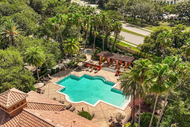 7348 Regina Way, Orlando, FL 32819 - community pool featuring a pergola, a patio, and view of scattered trees