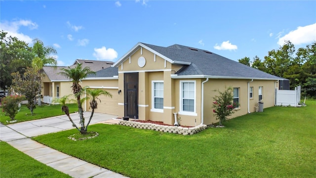 799 Hacienda Cir, Kissimmee, FL 34741 - view of front of house with stucco siding, an attached garage, a shingled roof, concrete driveway, and a front yard