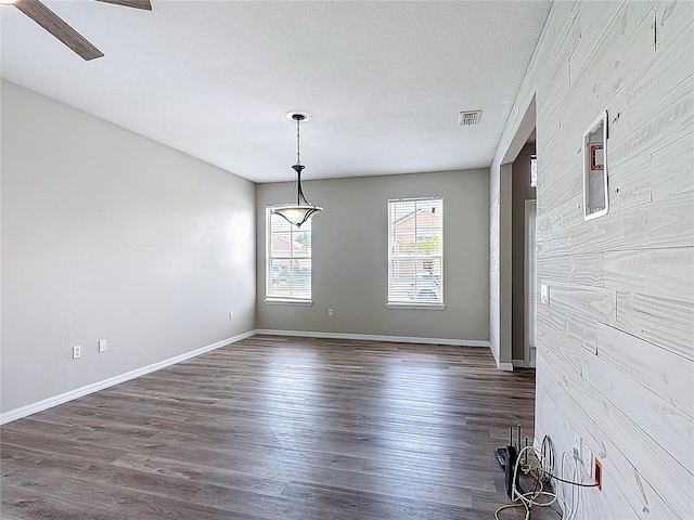 799 Hacienda Cir, Kissimmee, FL 34741 - spare room featuring dark wood-style floors and ceiling fan