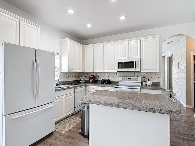 799 Hacienda Cir, Kissimmee, FL 34741 - kitchen featuring white appliances, white cabinetry, dark wood finished floors, and recessed lighting