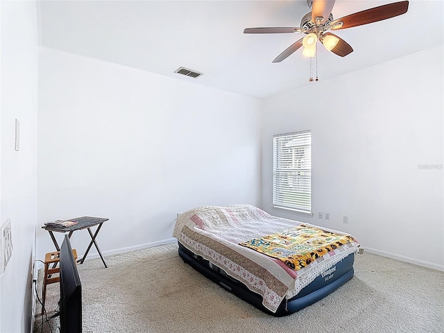 799 Hacienda Cir, Kissimmee, FL 34741 - carpeted bedroom with baseboards and a ceiling fan