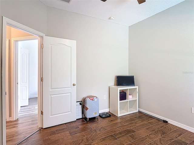 799 Hacienda Cir, Kissimmee, FL 34741 - unfurnished bedroom with wood finished floors and ceiling fan