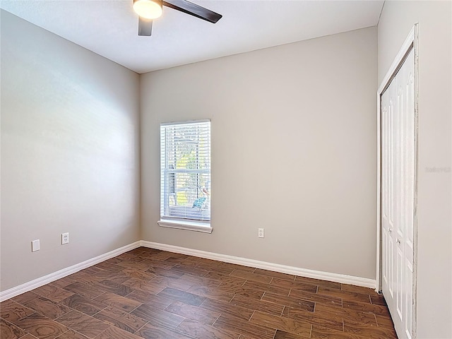 799 Hacienda Cir, Kissimmee, FL 34741 - spare room featuring a ceiling fan and dark wood-style floors