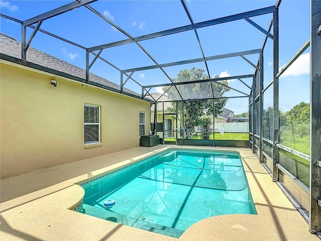 799 Hacienda Cir, Kissimmee, FL 34741 - outdoor pool featuring glass enclosure and a patio area