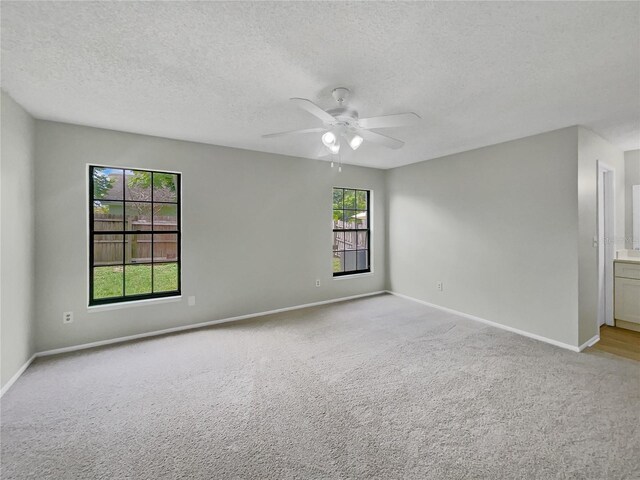 101 Whitley Bay Ln, Longwood, FL 32779 - empty room featuring a ceiling fan, carpet flooring, and a textured ceiling