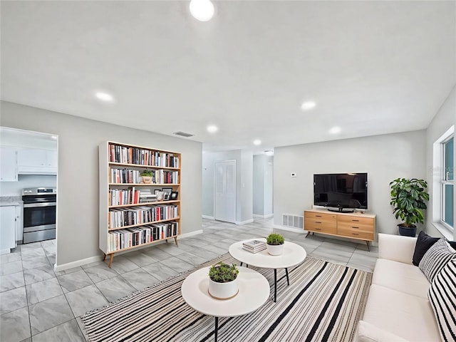 2607 Castle Oak Ave, Orlando, FL 32808 - living area featuring recessed lighting and light marble finish flooring