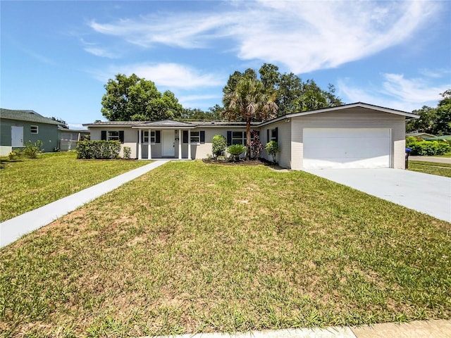 2607 Castle Oak Ave, Orlando, FL 32808 - single story home with an attached garage, driveway, and a front lawn